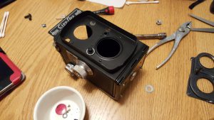 This shows the camera partially put back together. In this picture, I am missing a "collar" that goes in between the body and the hole for the taking lens.
