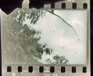 This is actual film that was damaged by the sprocket shaft in a stiff Kodak 35.