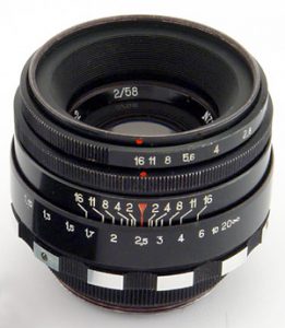 This is not my exact lens, but it shows both the preset ring on top, and then immediately below it is the aperture ring. Both must be used to properly set the correct aperture size while shooting.