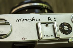 The Minolta A5 is quite an elegant camera. The logo is engraved prominently into an uncluttered top plate.