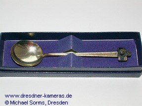 Silver spoon with an Exakta camera