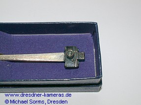 Silver spoon with an Exakta camera