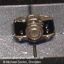 various Exa and Exakta lapel pins