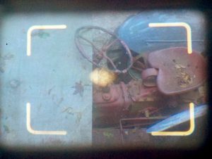 This is a view through the Electro's viewfinder. The diamond shaped yellow spot in the center of the image is the rangefinder window. Align both images on top of one another and your frame is in focus.